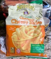 Mängden socker i Annie'S Organic Cheddar Cheesy Smiles. Baked Puffed Corn