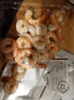 Mängden socker i queues de crevettes décortiquées cuites aux herbes