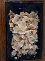 Mängden socker i chair de coques décortiquées crue surgelée