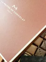 Mängden socker i Coffret pralinés-chocolat noir et lait